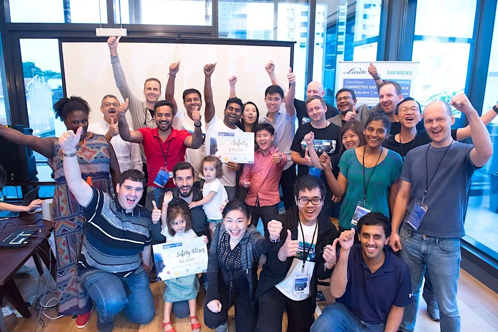 Siemens employees cheering in their office