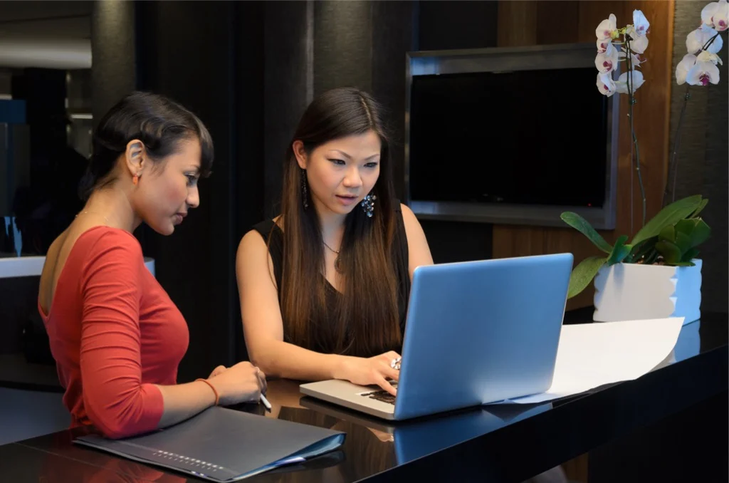 coworkers engaged in team discussion during office meeting