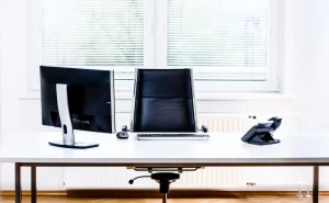 Man reviewing resume on laptop with coffee