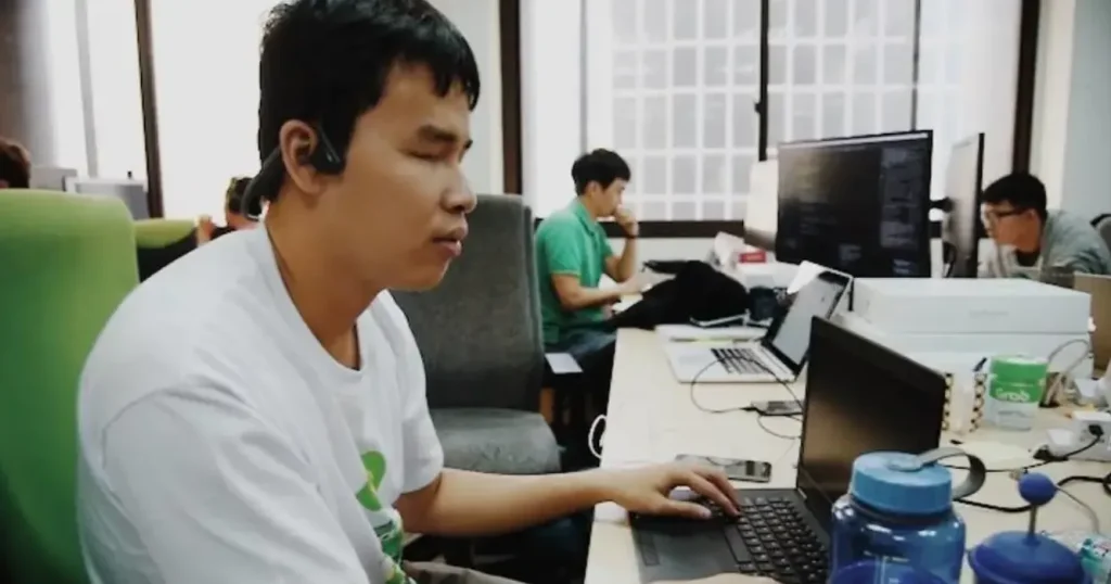 visually impaired jobs in grab singapore, visually impaired man using his laptop
