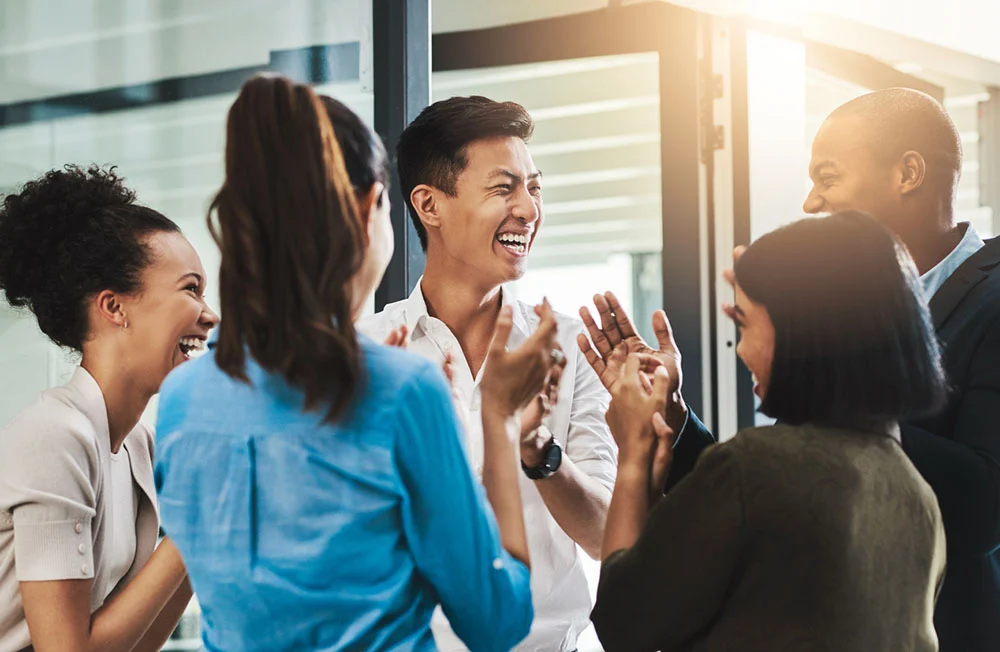 Professional workplace iStock photo, a group of colleagues happily discussing