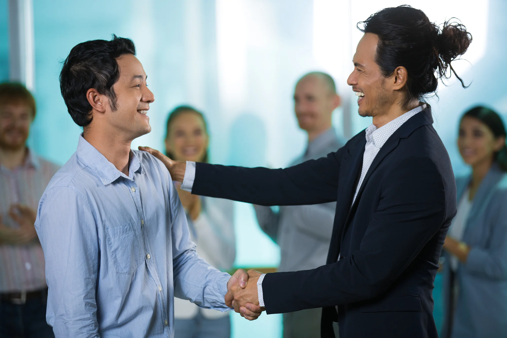 two men shaking hands, career switch singapore