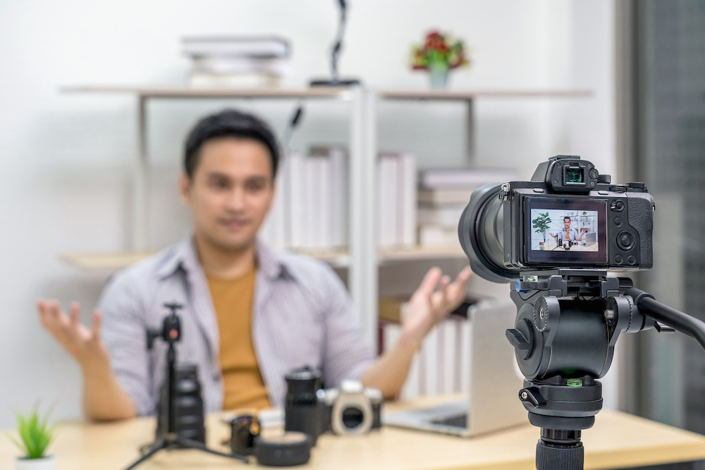 A youtuber recording himself on camera