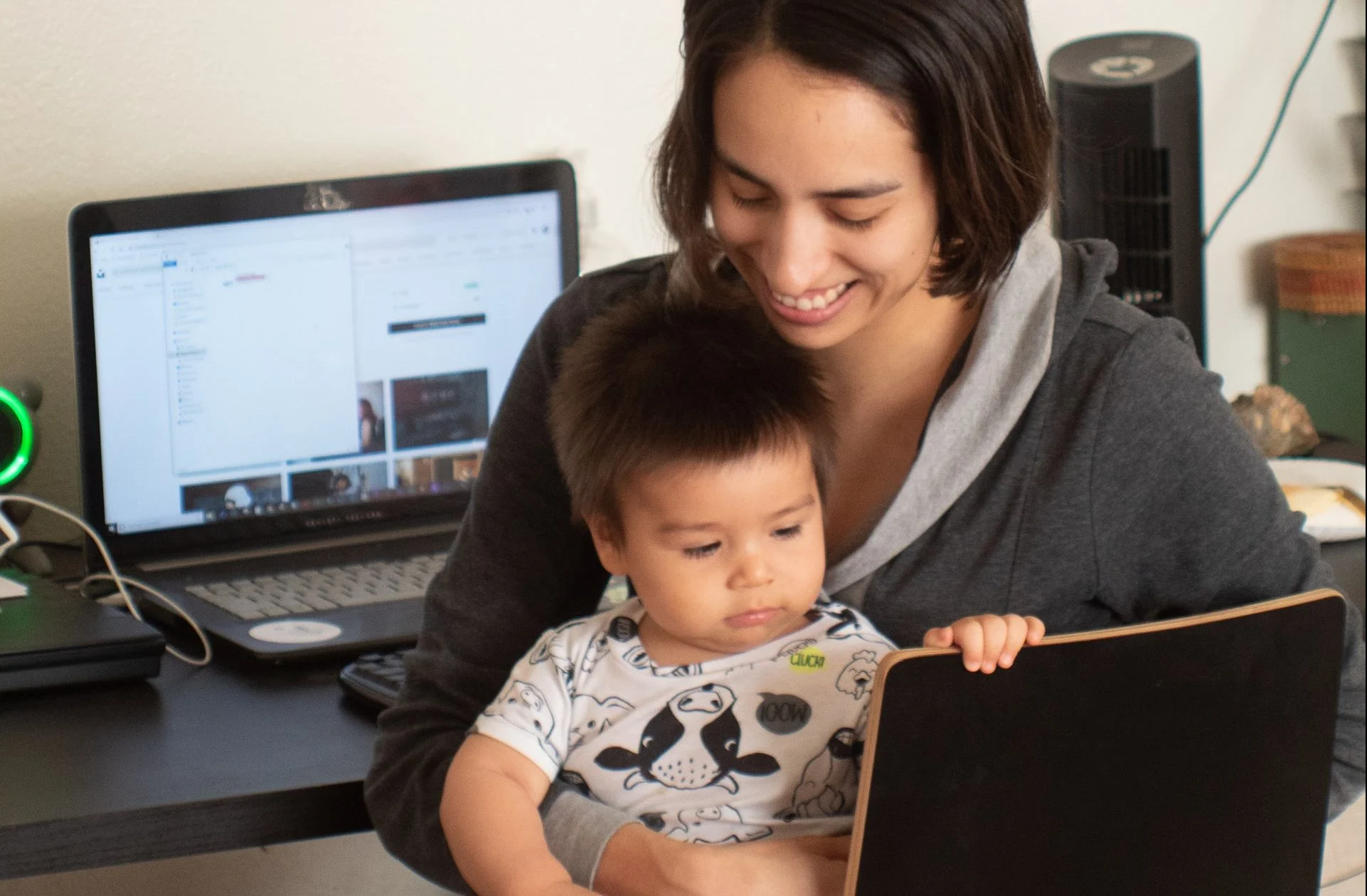 a mum carrying his baby