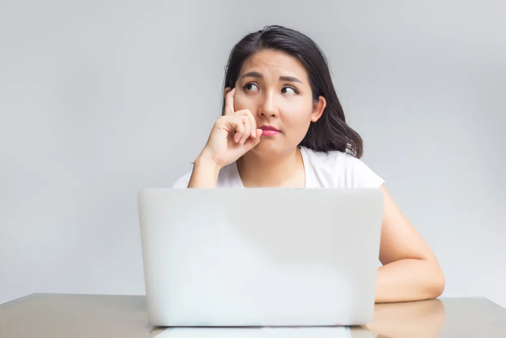 job hunting singapore, a woman thinking of some stuff