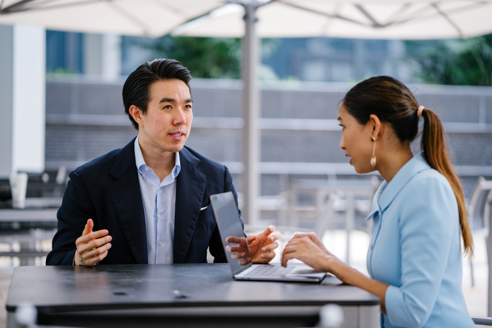 Woman reviewing man working performance