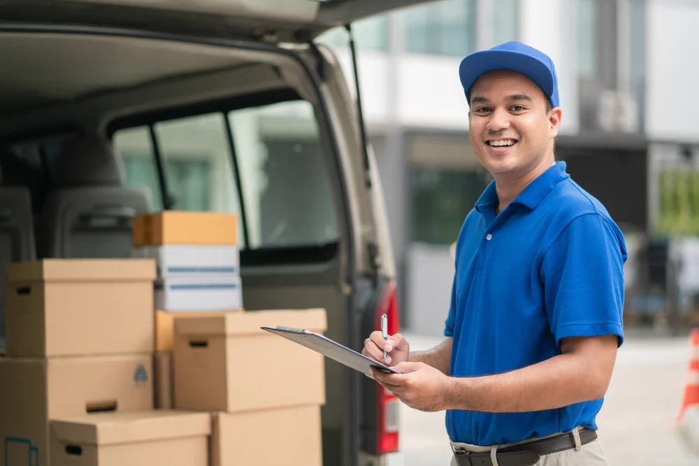 a delivery man smiling happily in his part-time job