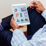 Man looking through presentation slides on ipad