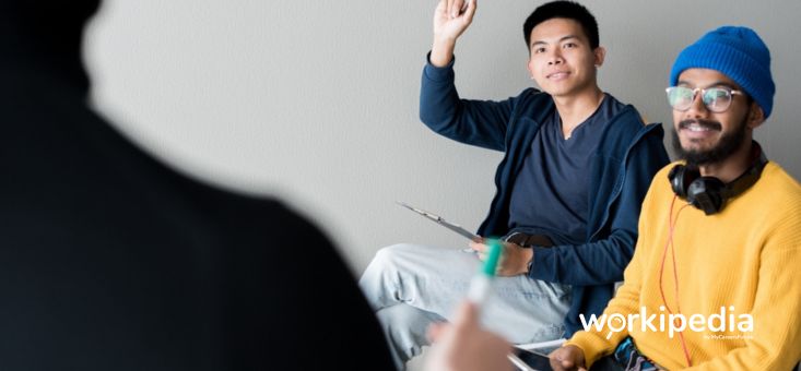 Asian student having question at training class