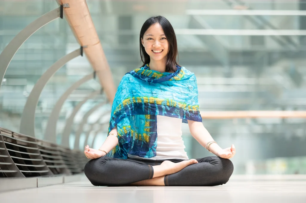 a woman meditating, career break