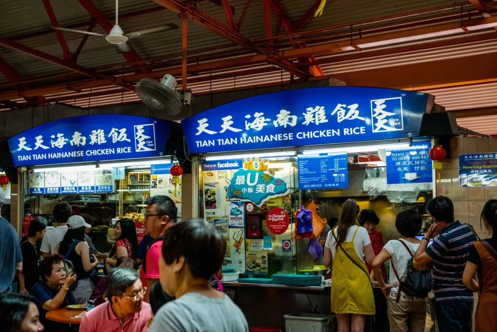 Small business owner holding open sign at storefront