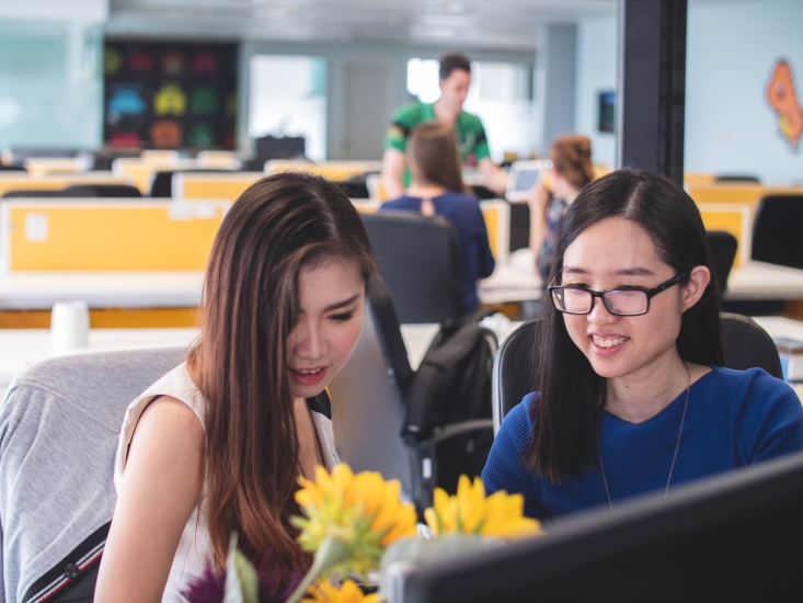 Two ladies going through work discussion