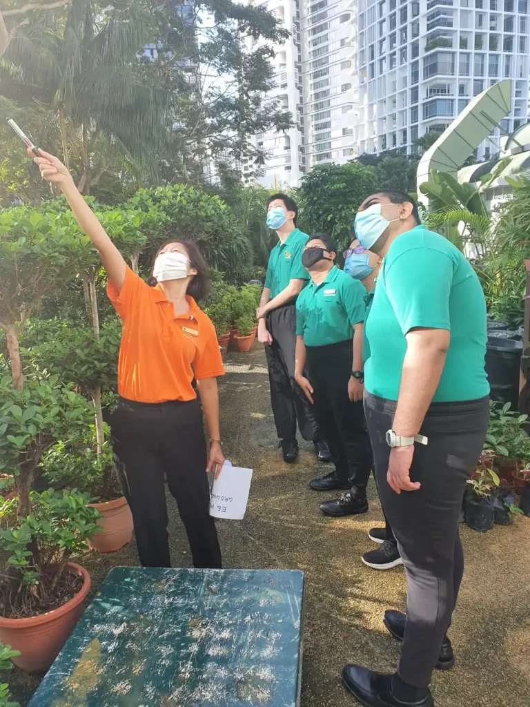 Shangri-La Singapore’s Ms Sim Ee Min, Service Manager – Gardens and Landscaping, together with interns from SG Enable’s School-to-Work Transition Programme. (Image Credit: SG Enable)