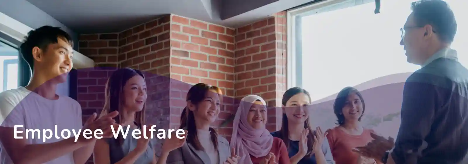colleagues applauding a co-worker - Employee Welfare banner