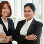 Two women working happily as lawyers