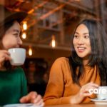 two coworkers having coffee together