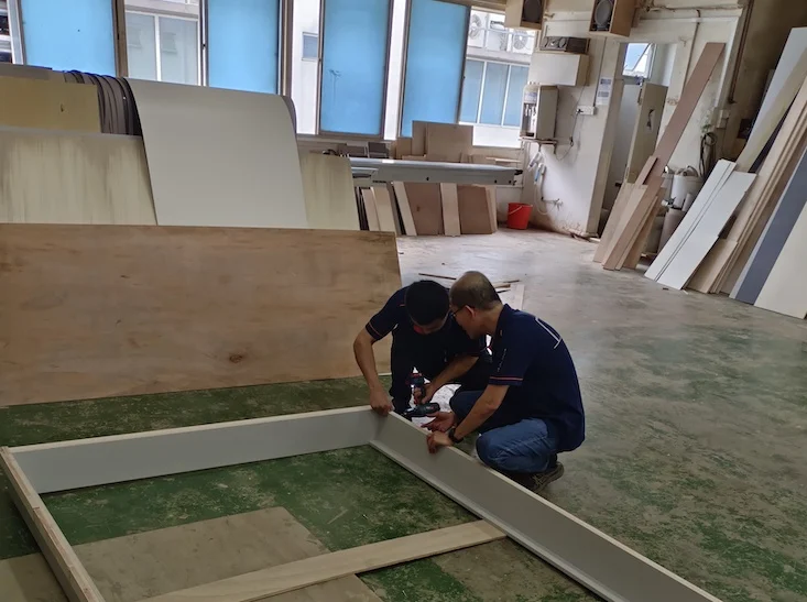 Kelvin at work, handling the assembly of furniture and installation