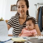 a mother with a baby working from home