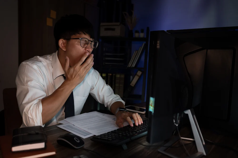 Professional man working overnight