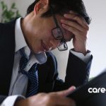 man in suit looking stressed