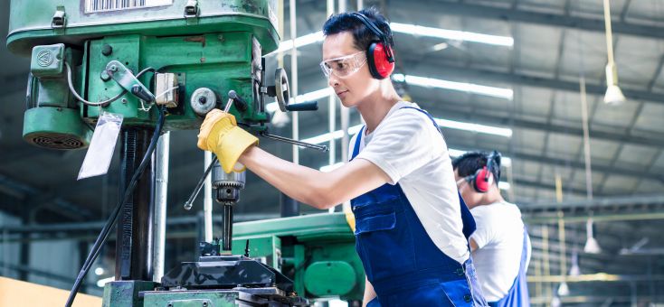 worker handling a machine