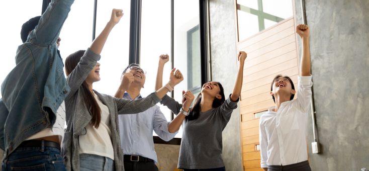 Office employees celebrating