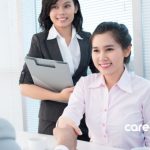 Employer and employee having a meeting and good first impression, choosing your first employer and not burning bridges. young professional researching employers on laptop before first job