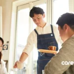 a waiter serving drinks