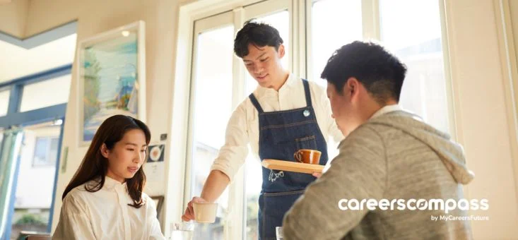 a waiter serving drinks