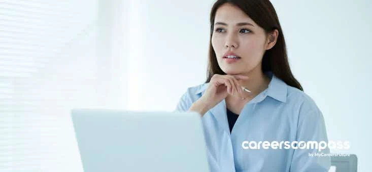 Asian woman in office blindsided by retrenchment and layoff exercise contemplating her next move