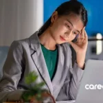 Asian woman in office dealing with sudden job loss and contemplating next move