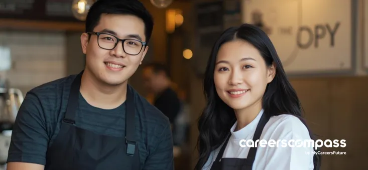 Young Asian male and female worker working as baristas at a cafe