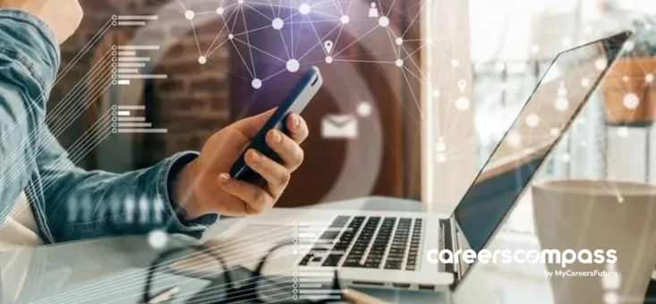 Hiring manager using AI in Recruitment working on their laptop